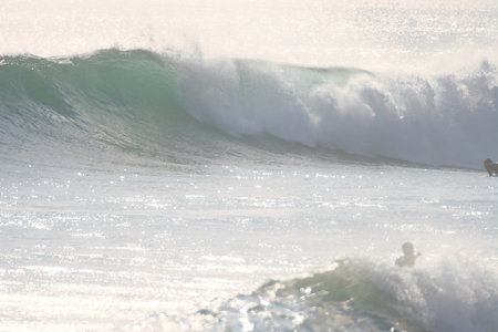 Surfing the ocean wave on a sunny day, Bali island, Indonesia