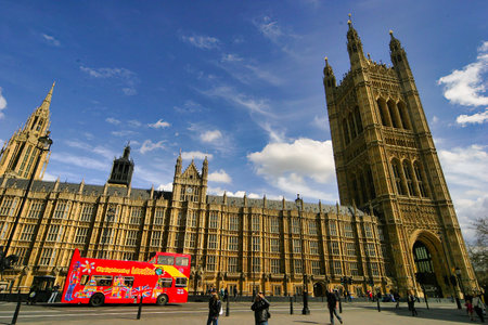 Tourist bus in front of the Houses of Parliament in London, UK
