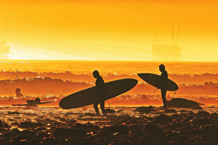 Surfers with surfboard on the beach at sunrise. Collage.