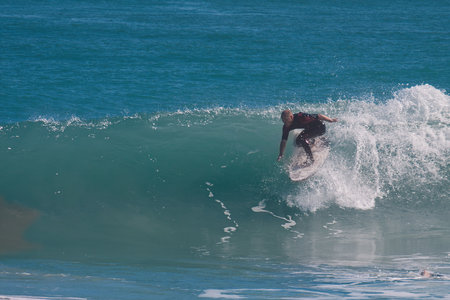 Surfer on the ocean wave at Rincon point, California.