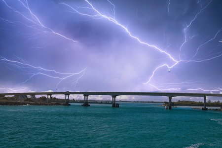 A thunderstorm is coming over a bridge in Florida, USA.の写真素材