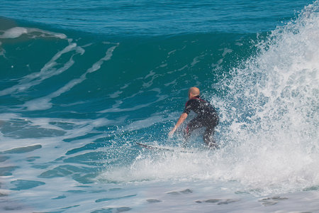 Bodyboarder in action on the ocean wave on a sunny day.の写真素材