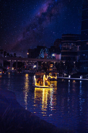 Milky way over the city at nightの写真素材