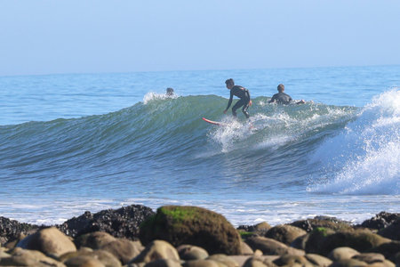 Surfer on Amazing Blue Ocean Wave at Rincon point, California