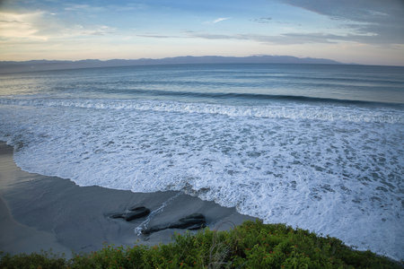 Coast of the Pacific Ocean at sunset, California, USA.