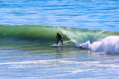 Surfer on the Blue Wave in Tenerife Canary Islands Spain