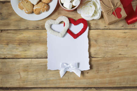 Composition Valentine's Day. Blank sheet of paper on a wooden background.の写真素材