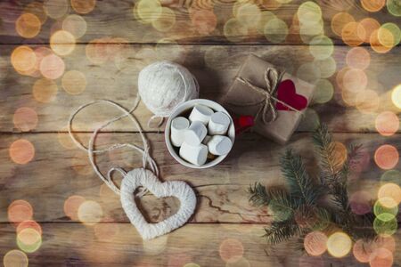 Gift with heart, marshmallow and heart handmade. Valentine's Day concept. Bokeh.の写真素材