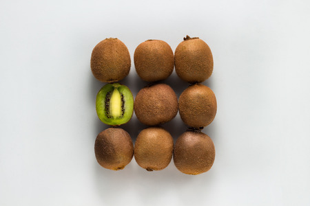 Conceptual image of a kiwi folded in the shape of a square on a white background.の写真素材