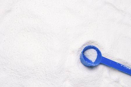 Pharmaceutical white powder and Blue Measuring Spoon. Can be used as a background or texture.の写真素材