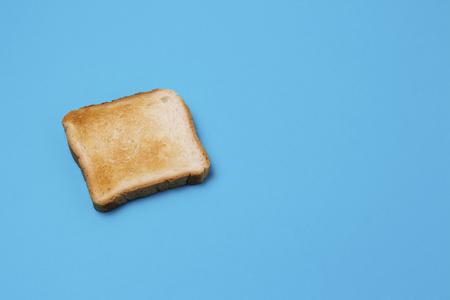 One slice of Toast on a blue background