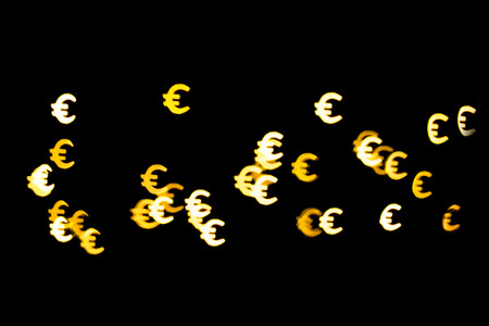 Bokeh as a Euro sign. The concept of wealth and money, trading on the stock exchange and economic...