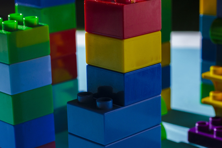 Columns from the children's designer on a blue background. The concept of building houses, new building. Flat lay, top viewの写真素材