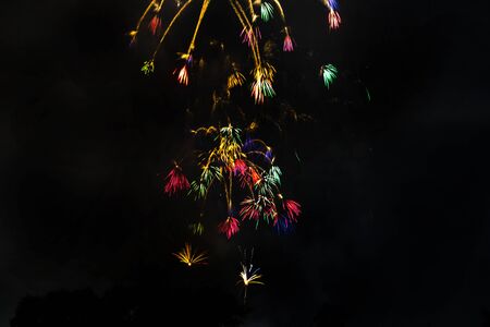 Awesome isolated Festive fireworks on a dark background. Can be used as wallpaper or background.の写真素材