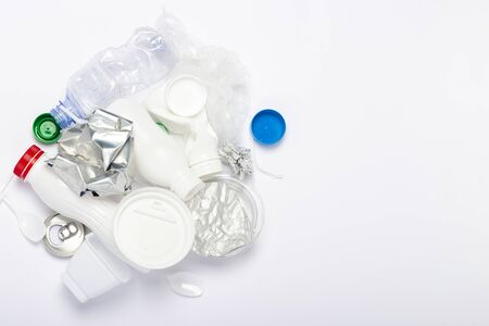 Garbage collection, plastic and metal on a white background. Concept stop plastic, recycling,...
