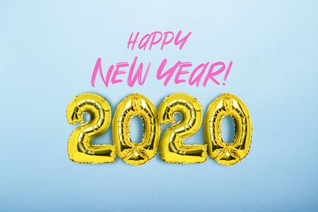 Golden air balloons numbers 2020 on a blue background. Added text. The concept of the New Year, New...