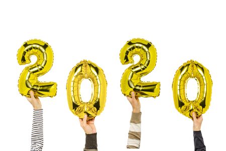 Hands holding balloons numbers 2020 on a white background. Concept new year, the onset of 2020, the year of the white rat.の写真素材