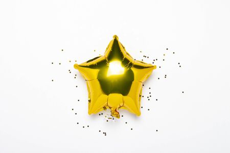 Air golden balloons star shape and candy on a white background. Concept for holiday, party, photo zone, decoration. Banner Flat lay, top view.の写真素材