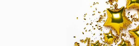 Air golden balloons star and confetti shape on a white background. Concept of a holiday, party,...