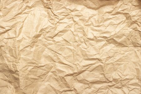 Crumpled brown craft paper. Texture, banner. Can be used as background. Top view, flat lay.
