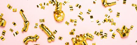 beautiful background, gold confetti scattered on a pale pink background. The concept of decoration,...