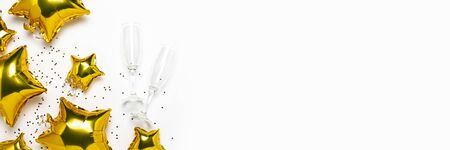Air golden balloons star shape and candy on a white background. Concept for holiday, party, photo...