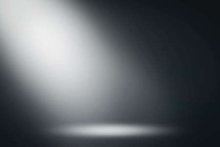 On a black background, the spotlight shines down. Light source, artificial light