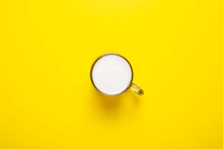 Glass with beer on a yellow background. Concept series, film, sports. Banner. Flat lay, top view.の写真素材