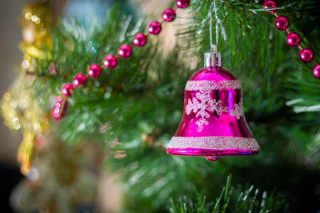 Decorated Christmas tree closeup. Christmas tree decorated with decorative toys, decorative small stick close-up. The concept of winter holiday decorations, Christmas, New Year.の写真素材