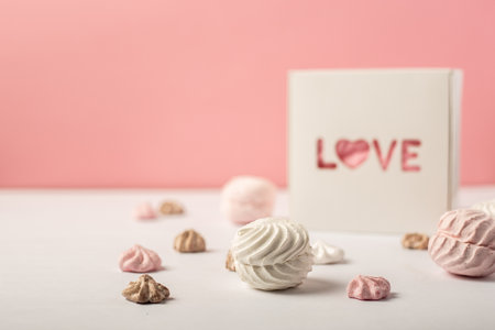 Gift box with the inscription Love and sweets on a pink background. Valentine's Day gift concept....