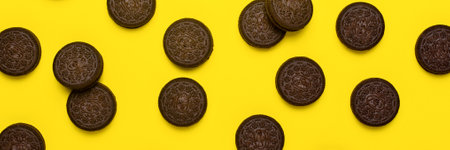 Chocolate chip cookies on yellow background, flat lay, top view. Bannerの写真素材