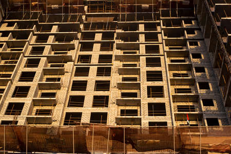Construction of a new modern skyscraper or residential building, bottom up view