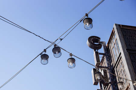 Street lights against the blue sky. City lighting, bottom-up viewの写真素材