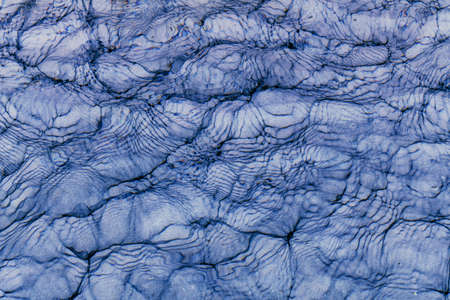 blue sea surface on a cloudy day. Background. Top view