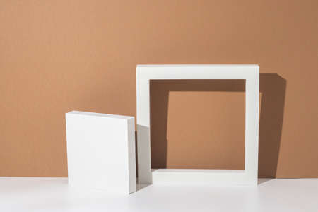 White podiums for presentations on a brown background. Top view, flat lay.の写真素材