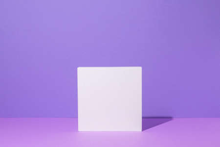 Square white podium for pedestal presentations on a lilac background.の写真素材
