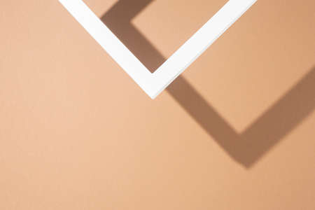 White presentation podium frame on brown background. Top view, flat lay.の写真素材