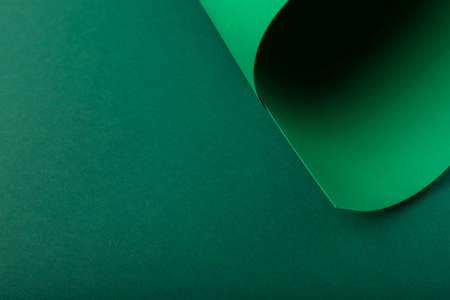 Design background of folded curl from green cardboard. Top view, flat lay.の写真素材