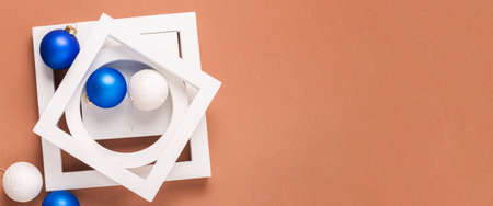 Winter holidays concept from geometric shapes, Christmas tree decorations. Banner. Flat lay, top view.の写真素材