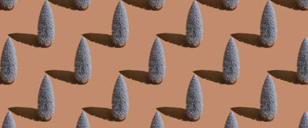 A lot of Christmas tree on brown background. Top view, flat lay. Banner.の写真素材