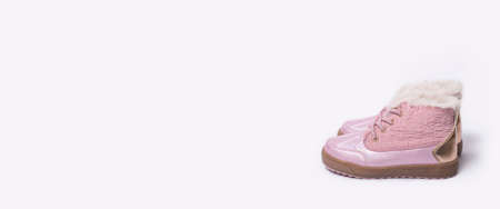 Fashionable children's boots for a girl on a white background. Banner