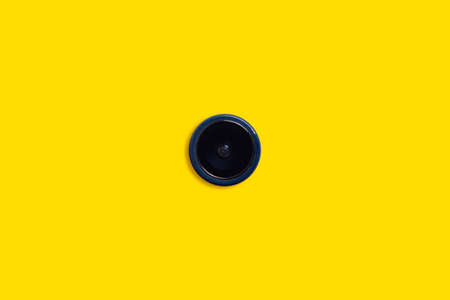 Camera on a yellow background. Photo camera, video surveillance, shootingの写真素材