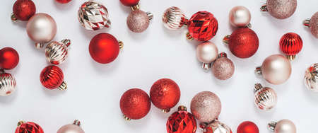 Beautiful decorative balls on a white background. Top view, flat lay. Banner