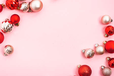 Decorative balls, empty space for text on a pink background. Top view, flat layの写真素材