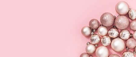 Decorative pink balls on a pink background. Top view, flat lay. Bannerの写真素材