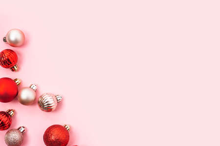Decorative balls, empty space for text on a pink background. Top view, flat layの写真素材
