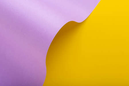 Wave from lilac cardboard on a yellow background. Top view, flat lay.の写真素材