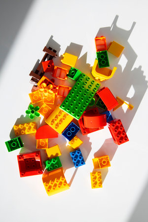 Children's multi-colored plastic constructor on a white background. Top view, flat lay. creative and educational conceptの写真素材