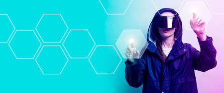 Young woman in virtual reality glasses pressing with fingers on a touchscreen, add a gradient on a...