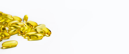 Vitamins in capsules fish oil, omega 3 and vitamin D on a white background. Bannerの写真素材